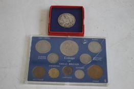A 1935 CROWN AND A 1953 COIN SET 1/4 d - crown in presentation boxes.