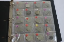 AN ALBUM OF BRITISH COINS FARTHING - HALF CROWN, mostly 20th century to include pre- 47