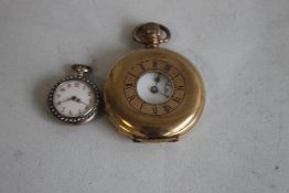 A CONTINENTAL GILT METAL ENAMELLED LADIES FOB WATCH, with pearl set bezel and borders along with a