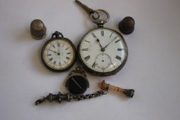 A LATE 19TH CENTURY OPEN FACE KEY WIND POCKET WATCH, with a ladies fob watch, two thimbles and two
