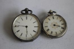 TWO LATE 19TH CENTURY WHITE METAL CASED FOB WATCHES, both with engraved cases.