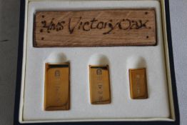 ROYAL MINT HMS VICTORY/ GOLD INGOT SET. consisting of a piece of Victory wood and 3 graduation 9ct
