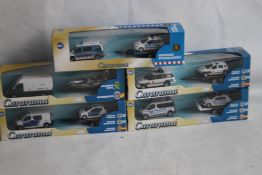 FIVE CARARAMA BOXED POLICE VEHICLES WITH TRAILERS (5)