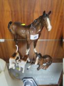 A BESWICK SWISH TAIL HORSE, TOGETHER WITH A FOAL AND TWO HOUNDS