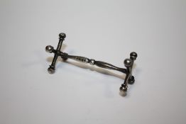 A HALLMARKED SILVER KNIFE REST