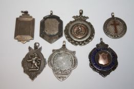 SEVEN HALLMARKED SILVER FOB MEDALLIONS