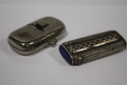 AN ANTIQUE CONTINENTAL SILVER VESTA A/F TOGETHER WITH A STEEL EXAMPLE