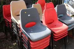 A LARGE QUANTITY OF STACKING CHAIRS