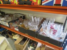 FOUR TRAYS OF ASSORTED GLASSWARE TO INCLUDE A LARGE QUANTITY OF CUT GLASS, DRINKING GLASSES ETC.