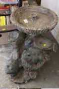 A TREE TRUNK DESIGN BIRD BATH WITH FROG FIGURES
