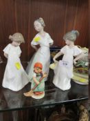THREE FEMALE NAO FIGURINES, TOGETHER WITH A GOEBEL FIGURE (4)