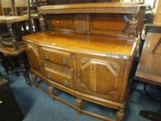 A LARGE CARVED OAK SIDEBOARD CIRCA 1930, W 152 CM