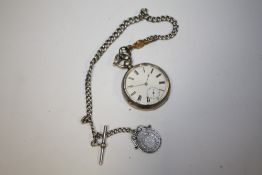 A SILVER POCKET WATCH ON ANTIQUE SILVER CHAIN AND FOB