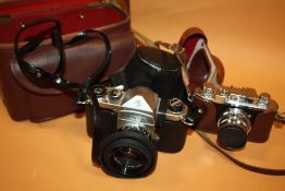 A VINTAGE PENTAX CAMERA AND ACCESSORIES TOGETHER WITH A VINTAGE HALINA CAMERA