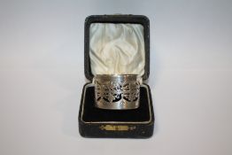 A BOXED PIERCED HALLMARKED SILVER NAPKIN RING