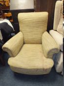 A VINTAGE HOWARDS STYLE UPHOLSTERED ARMCHAIR