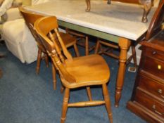 A MODERN KITCHEN TABLE AND FOUR CHAIRS