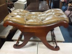 A REPRODUCTION MAHOGANY AND GREEN LEATHER STOOL