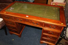 A REPRODUCTION YEW WOOD PEDESTAL DESK WITH GREEN LEATHER INSERT TOP W- 122 CM