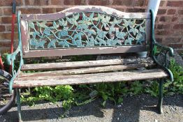 A GARDEN BENCH A/F WITH CAST LEGS AND BACK PLATE