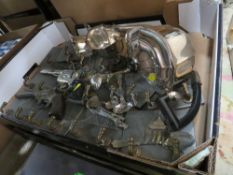 TWO TRAYS OF METALWARE TO INCLUDE REPRODUCTION PISTOLS, SILVER PLATED METALWARE ETC.