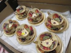 A SET OF SIX AYNSLEY ORCHARD GOLD CHINA CUP, SAUCER AND SIDE PLATE TRIOS