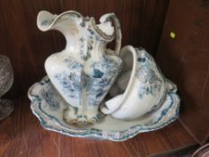 AN ANTIQUE FLORAL FIVE PIECE JUG AND BOWL SET STAMPED OUKE TO BASE