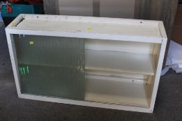 A VINTAGE PAINTED WOODEN CABINET WITH SLIDING DOORS