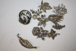 A BOX OF VINTAGE MARCASITE BROOCHES