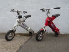 A PAIR OF MANTIX XP ELECTRIC SCOOTERS AF. Both with keys and one battery charger.