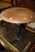 A CAST IRON BASE PUB TABLE