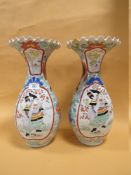 A PAIR OF ORIENTAL BALUSTER VASES WITH FRILLED RIMS, each vase decorated with a figure in a shaped c