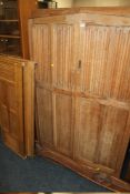 AN OAK LINENFOLD DOUBLE WARDROBE TOGETHER WITH BEDHEADS