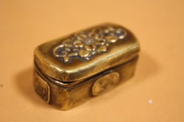 AN ANTIQUE BRASS PATCH BOX