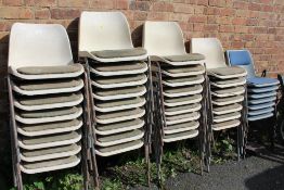 A LARGE QUANTITY OF STACKING CHAIRS WITH PADDED SEATS