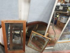 AN OAK FRAMED OVAL WALL MIRROR TOGETHER WITH A PINE FRAMED RECTANGULAR WALL MIRROR AND TWO OTHERS (