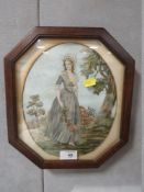 A MAHOGANY FRAMED AND GLAZED VINTAGE NEEDLEWORK OF A LADY CARRYING FLOWERS, INDISTINCT SIGNED