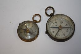 TWO ANTIQUE BRASS COMPASSES