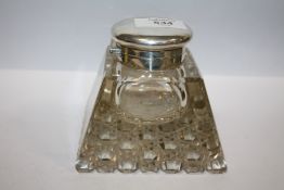 A LARGE HEAVY CUT GLASS DESK INKWELL WITH HALLMARKED SILVER MOUNTS - LONDON 1909