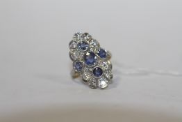 A SAPPHIRE AND DIAMOND RING, set with ten brilliant cut diamonds and five sapphires, hallmarks