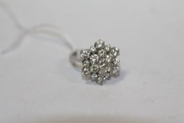 AN 18CT GOLD DIAMOND CLUSTER RING, estimated 1.6 carats in totalCondition Report:Ring size N
