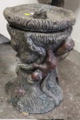 A TREE TRUNK DESIGN BIRD BATH WITH SQUIRREL FIGURES
