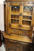 A MELLOWCRAFT QUALITY OAK CARVED AND GLAZED DISPLAY BOOKCASE H-194 CM W-135 CM