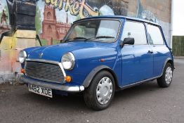 A 1996 BLUE ROVER MINI SPRITE N482 XOE, 1275cc petrol, three door saloon car, log book states