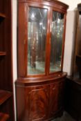 A REPRODUCTION MAHOGANY DOUBLE CORNER CABINET