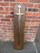 A FRANKLIN MINT SWORD OF CHARLEMAGNE. The decorated gold leaf lion headed handle having lapis lazuli