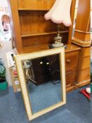 A GILT CHERUBESQUE TABLE LAMP AND A DECORATIVE MIRROR (2)