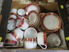 A SMALL TRAY OF RED AND GILT LIMOGES CHINA