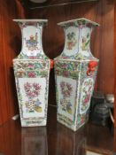A PAIR OF ORIENTAL CERAMIC TWIN HANDLED FAMILLE ROSE VASES WITH FOUR CHARACTER BACK STAMP, H 45 CM