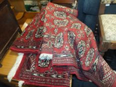 THREE ASSORTED 20TH CENTURY RED RUGS